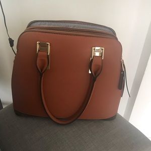 Tan purse very big has deep pockets bran new